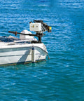 Powerful 4HP 55CC Outboard Motor with Short Shaft mounted on small boat in blue water