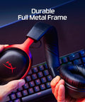 Hands holding Cloud III Wired Gaming Headset For PC PS5 Xbox Series X S With Angled 53mm Drivers, showing durable aluminum frame.