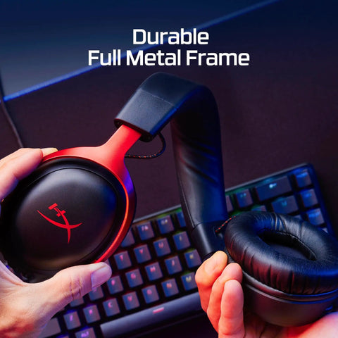 Hands holding Cloud III Wired Gaming Headset For PC PS5 Xbox Series X S With Angled 53mm Drivers, showing durable aluminum frame.