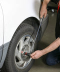 Person using Three Eighths Inch Drive Ratcheting Breaker Bar, 15 Inch Length, 24 Tooth Ratchet, Heavy Duty Chrome Vanadium on car tire.