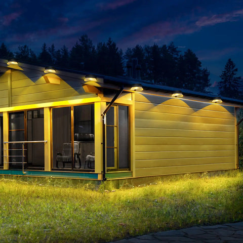 Solar Fence Lights Six Pack With 9 LED Warm White Outdoor Waterproof UFO Design mounted on house eaves for garden decor
