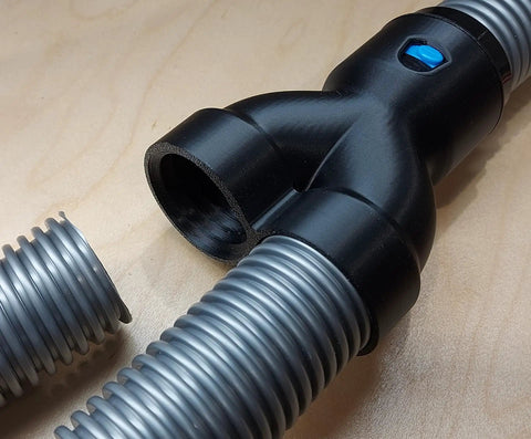 40mm Vacuum Hose Y Splitter Adapter with Swivel Fittings, shown splitting a hose into two ports for dust collection on tools