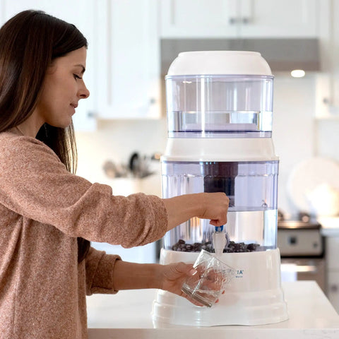 Woman using Ceramic Pre Filter Replacement for Gravity Water System Lets You Get Cleaner Water With 0.3 Micron Filtration and Particle Removal