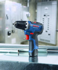 12V Max EC Brushless 3/8 Inch Drill Driver Bare Tool with Pro Torque 300 In-Lbs on industrial metal surface in workshop