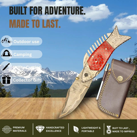 Damascus Steel Folding Knife With Ladder Pattern Blade And Copper Fish Style Handle, brass grip, leather sheath outdoors.