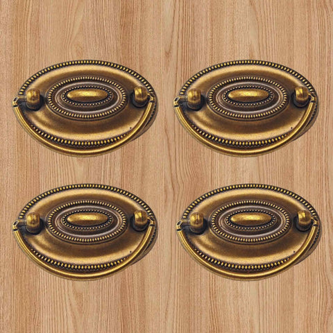 Antique Cabinet Ring Pulls Set Of 2, Vintage Drop Drawer Handles in distressed gold finish on wood background.