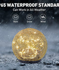 Cracked Glass Globe Solar Garden Lights Waterproof Warm White LED For Outdoor Decor glowing in rainy weather