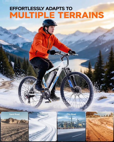 Person riding High Power 1000W Electric Mountain Bike For Adults With 26 Inch Frame on snowy trail, mountain background.