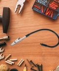 Alligator Clamp Welding Holder With Adjustable Flexible Arm And Magnifying Lamp Clip on workbench with tools and hardware
