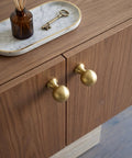 Top Shelf Brushed Gold Cabinet Knobs Six Pack For Modern Kitchen Drawers And Dressers Crafted From Solid Zinc Alloy Ridge Tough Construction Quick Install Mounting on wooden cabinet.