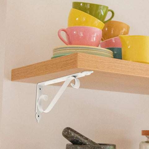 Heavy Duty Corner Shelf Brackets Wall Mount Supports Rock Solid Iron L Brackets Built Like A Tank For Diy Wood Shelving And Workshop Storage Super Sturdy Black Metal Braces Zero Stress Setup with a white metal bracket.