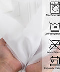 Close-up of hand holding Two Lightweight White Sheer Curtain Panels 42 Inch Wide By 72 Inch Long With Rod Pockets airy voile fabric