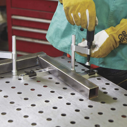 4 Piece Welding Table Clamp Kit With Lightweight Aluminum Frame And ABS Handle in use on 16mm hole table, easy setup and secure hold