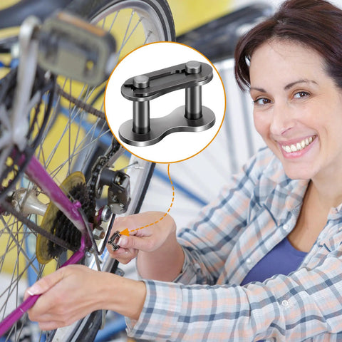 Woman installing Five Pack No. 41 Roller Chain Connecting Links Made From Master Manganese Steel on bicycle