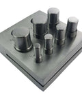 7 Piece Circular Disc Cutter Set for metal crafting, showing 7 punches on a metal base, for 1/4 inch to 5/8 inch discs.