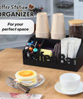All In One Coffee Bar Organizer For Countertop Wooden Station Caddy With Tray For Pods Cups Condiments And Accessories Kitchen Or Office Counter Storage Medium Size Black Finish on kitchen table, displaying coffee pods and cups.