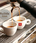 Espresso Puck Screen 51mm, 316 Stainless Steel in use with espresso maker pouring coffee into white cups