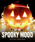 Jack-o'-lantern decorated with string lights and Orange LED Lit Flame Bulbs With Four Modes Indoor Outdoor Use 3W E26 E27 2 Pack