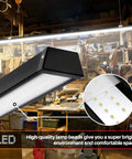 Black 8ft LED Shop Light, 100W 12500lm, 5000K Daylight, Super Bright and Energy Efficient, dual mount, in workshop setting.
