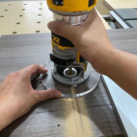 Legit 6 Inch Round Clear Acrylic Router Base Plate Upgrade Featuring Pre Drilled Alignment Holes For DWP611 DCW600B Compact Routers used in woodworking.