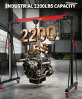 Hella Adjustable 1 Ton Gantry Crane, 2200 Lbs Portable Garage Hoist lifting an engine in a warehouse, showcasing strength and capacity.