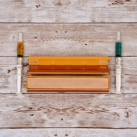 5/3.5 Micron Diamond And Leather Strops Pack For Knife Sharpening Dual Sided Strop Set with syringes on wooden background
