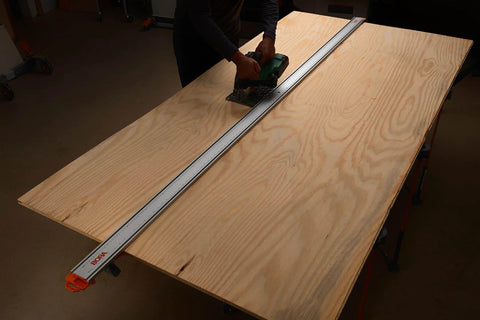 Person using NGX 96 Inch Clamp Edge System With Quick Connect And Quick Lock Lever For Fast, Accurate Straight Cuts On Circular Saws