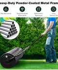 Person using Push And Tow Lawn Roller With Ergonomic Handle And Scraper Bar For Easy No Fuss Soil Compaction In Lawns Yards Parks And Farms A Versatile Manual Yard Care Tool For Gardening And Lawn Maintenance