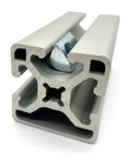 Roll-In T-Nut With Ball Spring 5/16-18, 24 Pack, installed in 15 Series aluminum extrusion 13040 profile, side view