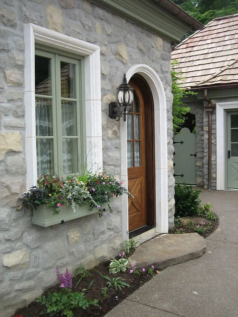 Two Pack Outdoor Wall Lanterns Waterproof Exterior Sconce Lights In Matte Black for porch beside a stone wall and wooden door