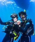 Divers underwater wearing Liberator BCD With AWLS III and RiteTite Harness for boss level tank stability in deep dive setting.