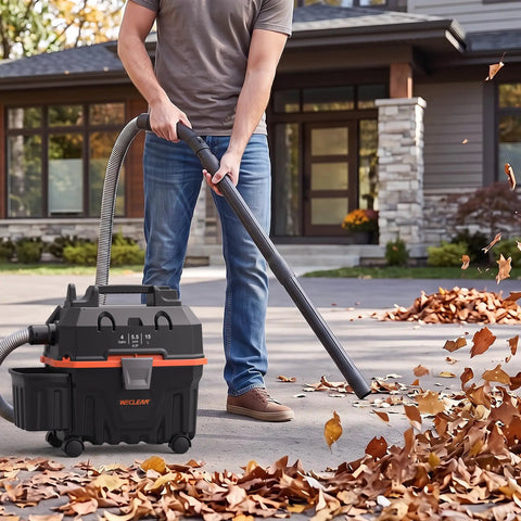 Heavy Duty 4 Gallon Wet Dry Shop Vacuum With 5.5 Peak HP Blower Function being used to clean leaves outdoors.