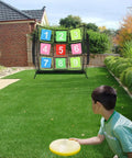 Child throwing disc at Portable Disc Golf Training Net With Nine Target Grids For Backyard Indoor Outdoor Practice, easy setup