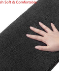 Hand touching soft surface of Bullnose Carpet Stair Treads 14 Piece Indoor Set Soft Non Slip Self Adhesive Stair Protectors in dark grey.