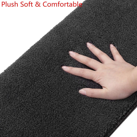 Hand touching soft surface of Bullnose Carpet Stair Treads 14 Piece Indoor Set Soft Non Slip Self Adhesive Stair Protectors in dark grey.