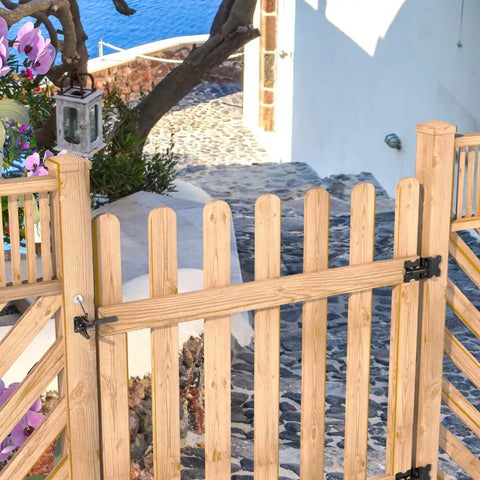 Heavy Duty Self Latching Gate Hook With Spring Release Cable on wooden gate, providing security for outdoor space.