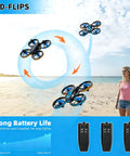 Lit RC Drone With Auto Hover and Headless Mode Quad Copter With LED Lights flying above a beach, showing 3D flips and triple battery.