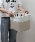 Person holding 11x11 Inch Cube Storage Bins Set Of 6 Collapsible Fabric Storage Cubes With Rope Handles, Foldable Organizer