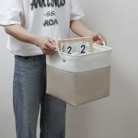 Person holding 11x11 Inch Cube Storage Bins Set Of 6 Collapsible Fabric Storage Cubes With Rope Handles, Foldable Organizer