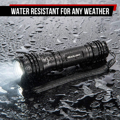 Ultra Bright LED Flashlight Kit S1050 Two Pack With Adjustable Zoom And 3 Modes For Camping Hiking Dog Walking And Emergencies Batteries Not Included All Weather Durable Build on wet surface