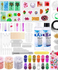 Beginner Resin Craft Kit With Molds And Silicone For Epoxy Resin Projects Includes Dried Flowers Foil Flakes Necklace Cord Earring Hooks Plus Tools And Easy Instructions For DIY Jewelry Making with molds, silicone, dried flowers, foil flakes, necklace cord, earring hooks, and colorful decorative items.