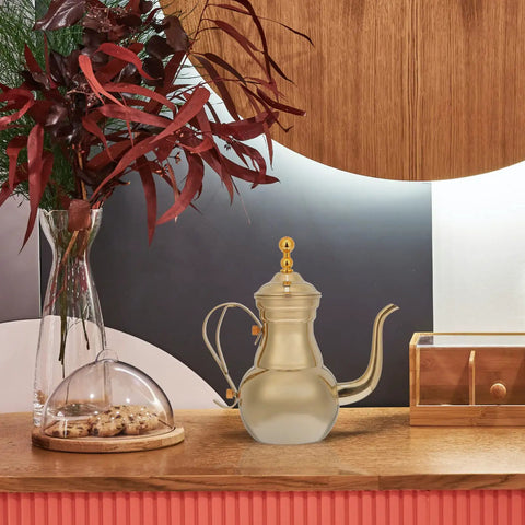 Golden Stainless Steel Turkish Coffee Pot Cezve Style For Rich Stovetop Brews At Home Pro-Grade Barista Finish With Even Heat Distribution And Easy Pour Spout 1 Count displayed on a wooden counter.