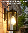 Dope Matte Black Outdoor Wall Light With Clear Glass Shade Weatherproof Front Porch Sconce in rain, mounted on brick wall