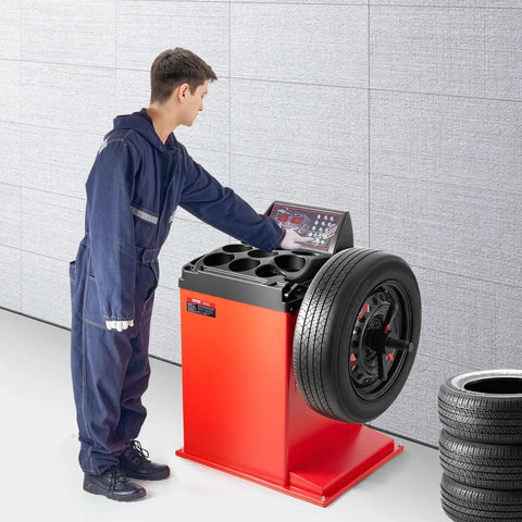 Mechanic using Electric Tire Changer And Balancer Combo With 18 Inch Spindle 2HP Motor Workhorse Build And High Precision Auto Calibration Balancer.