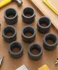 8 Pack 2 Inch PVC Pipe Fittings Female Adapters Schedule 80 Socket to NPT Connector displayed on a workbench with tools
