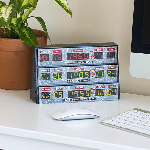 Back To The Future 3D Wall Lamp For Gaming Rooms And Space, Flicker Free Ambient Light, Eye Friendly LED Accent To Brighten Bedrooms, Office, Study, And Living Areas, Official Merchandise showing futuristic date display on desk