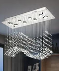 Dope Modern Rectangular Crystal Chandelier Flush Mount Ceiling Light with wavy chrome and K9 raindrop crystals in living space.