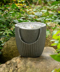 Outdoor Tabletop Water Fountain With LED Lights Made From Recycled Polyethylene Eco Friendly Materials For Patio Porch And Backyard Bubbling Water Feature UV Resistant Durable Yard Decor For All Weather on stone surface
