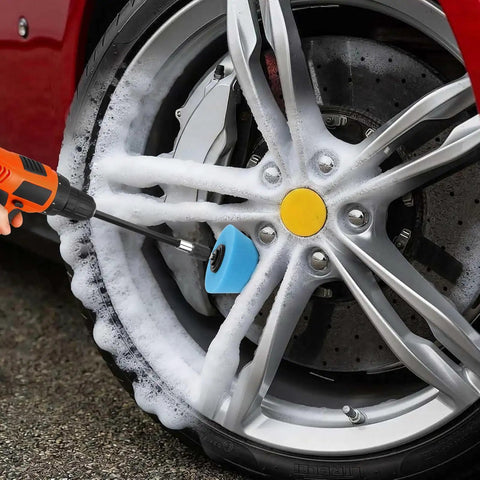 Six Piece Car Wheel Polishing Kit With Foam Cones And Balls One Quarter Inch Hex Extension Holder Pro Grade Dope Buffing Pads For Rims Hubs Exhaust Tips Aluminum And Chrome Metal Polishing Tools being used on a tire rim with foam cleaner
