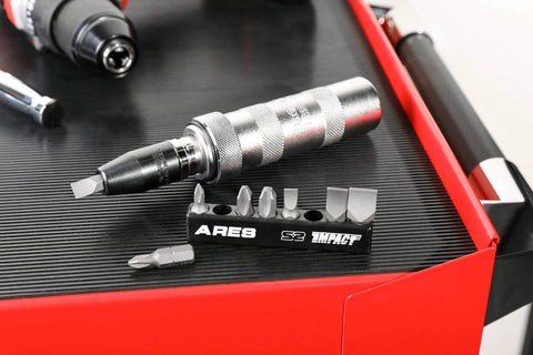 Close-up of Eight Piece S2 Steel Impact Driver Bit Set With Phillips 1 2 3 4 and slotted bits in plastic holder for construction projects.
